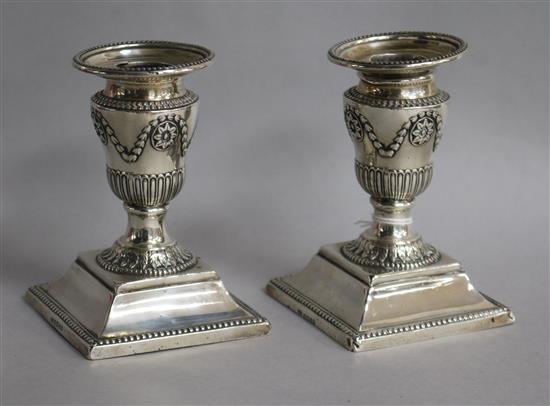 A pair of Victorian silver dwarf candlesticks, Sheffield, 1876, 11cm.